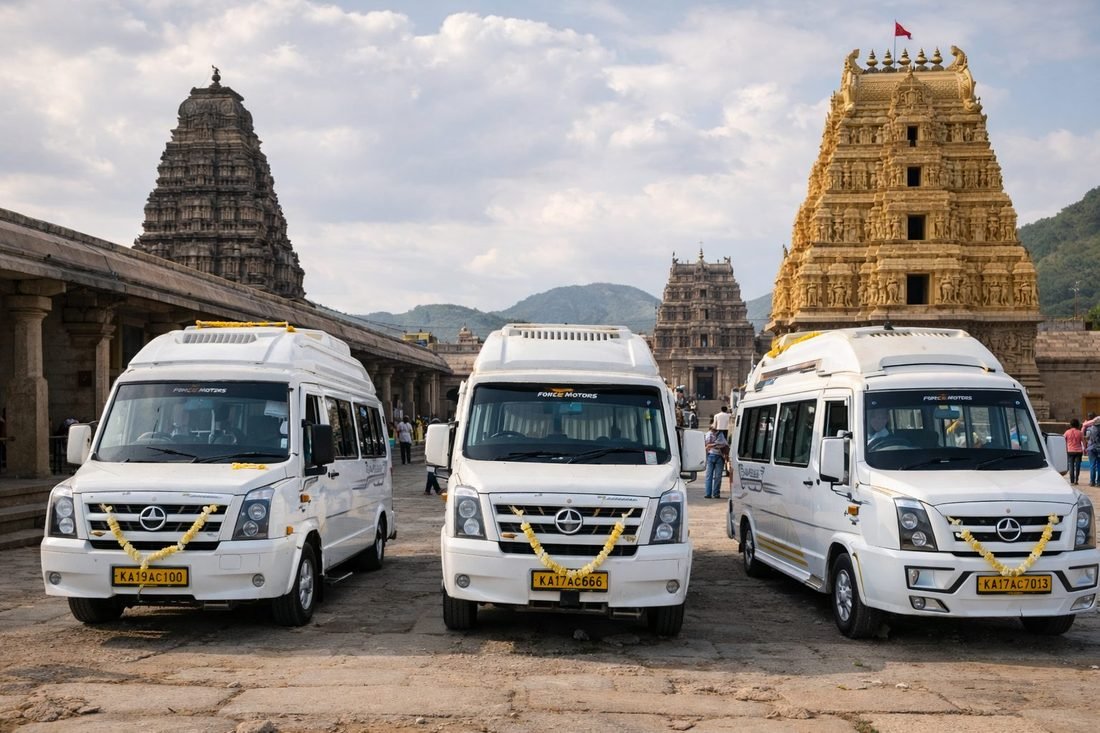 Basava Travels tempo travellers parked outside a temple